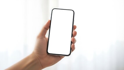 Hand holding a blank smartphone screen mockup against a soft white background