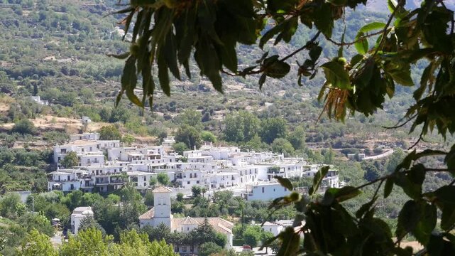 View of Bubi&oacute;n in the Poqueira Gorge, Alpujarra. White village of Berber architecture surrounded by nature in the mountains of Granada, Andalusia.