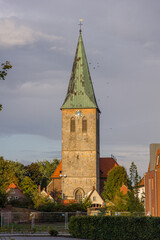 Historic church tower with copper roof, Meppen, Germany