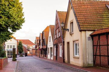 Charming cobblestone street with timber-framed houses in quiet European village