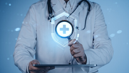 Doctor analyzing digital healthcare data concept using magnifying glass and tablet on futuristic blue background, symbolizing AI assistance in medicine.
