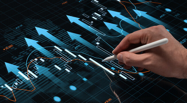 Hand with stylus touching futuristic digital screen showing growing financial charts and arrows on a high-tech business interface background. - Powered by Adobe