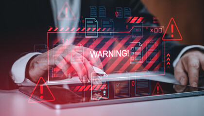 Cybersecurity warning concept with digital alert symbols and documents over tablet on corporate background in red tone, showcasing security threat detection.