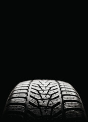 Vertical banner new winter tire against black background