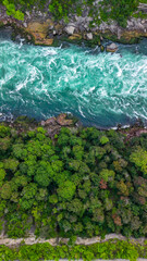 Scenic summer panorama of Niagara Falls river captured from above highlighting rapids and mist