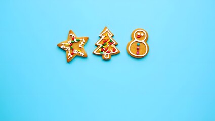 Colorful Christmas Cookies in Star, Tree, and Eight Shapes on Blue