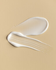 White Cosmetic Cream Smear on Beige Background