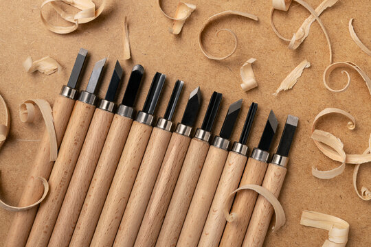 Wood Carving Chisels and Shavings on Workbench