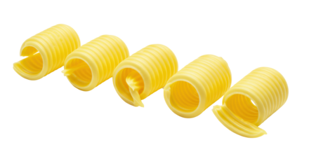 Five perfect golden yellow butter curls, intricately ridged, lustrous, on a pristine bright white background with ample copy space, a concept of culinary precision and elegance