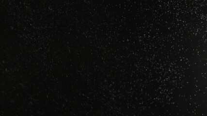 Fine dust particles floating in dark space abstract background texture overlay motion graphic element for cinematic effect - Powered by Adobe