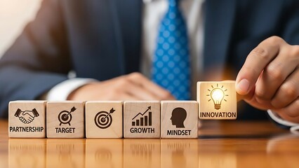 Business person carefully placing a final block representing innovation and success in a strategic plan