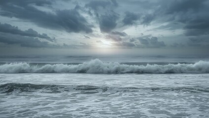 Ocean waves crashing on shoreline under cloudy sky at sunset  