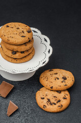 Delicious chocolate chip cookies are neatly arranged on a decorative plate