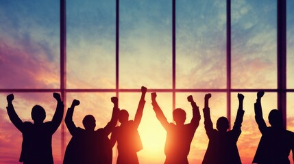 Group celebrates victory against sunset backdrop in office setting