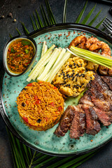Colorful rice bowl with steak and shrimp