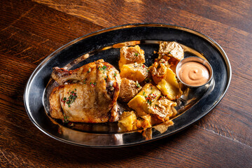 Roasted chicken with crispy potatoes and sauce