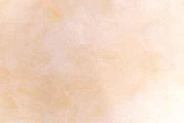 Textured peach background with soft light diffusion for design