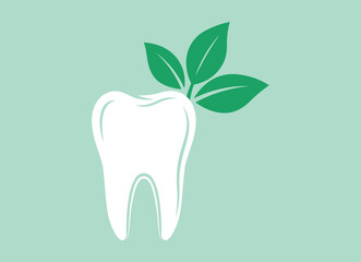 White tooth with green leaves on light green background dental health