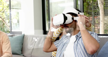 Man picking up headset, wearing, gesturing while AR weather cards overlaying during product demo