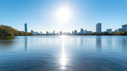 Fototapeta premium Radiant blue skyline reflection over calm lake with bright sun and serene mood