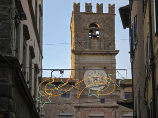 View of the clock tower of the town hall in Cortona at christmas time, Tuscany, Italy
