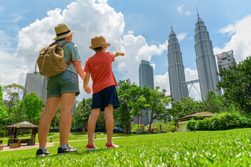Female tourist and her son enjoying cityscape of Kuala Lumpur