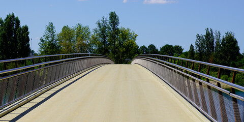 modern pedestrian bridge over water lake in bordeaux city on french sunny day