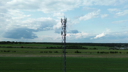 Cell tower on farmland during clear day