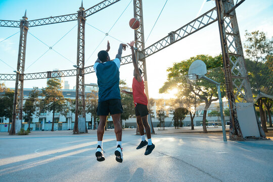 Young basketball players training at the court.