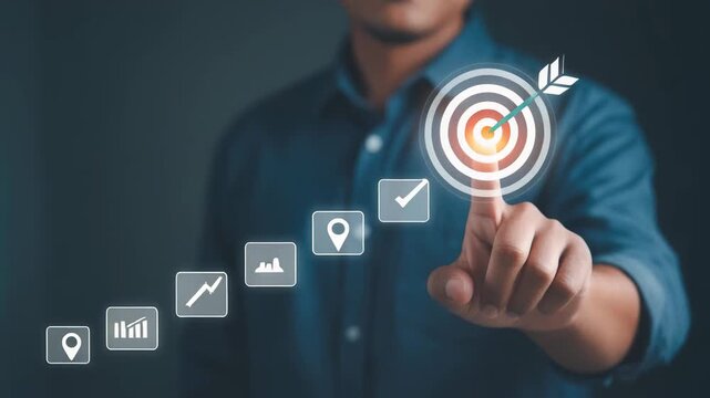 Businessman pointing at target icon achieving success and goals