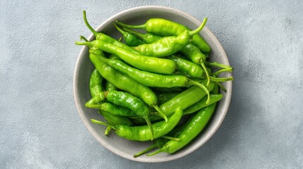 Fresh green chili peppers in a bowl