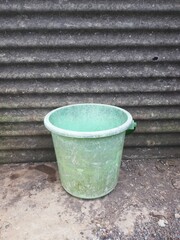 Old Green Plastic Bucket Outdoors &ndash; Rustic Utility Object