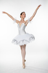 Naklejka premium Studio portrait of a ballerina in a white tutu