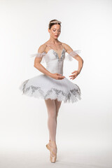 Naklejka premium Studio portrait of a ballerina in a white tutu