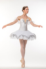 Naklejka premium Studio portrait of a ballerina in a white tutu