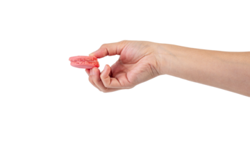 Pink and red macarons in hand on transparent background