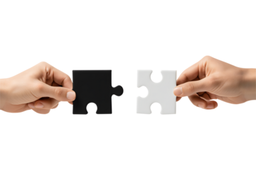 Hands connecting two white jigsaw puzzle pieces for a teamwork solution isolated on a white background