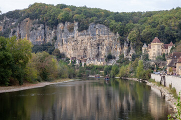 dordogne river landscape with cliff face historic village castle