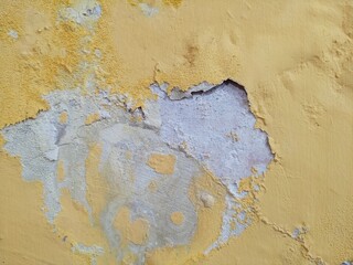 Severe Paint Peeling and Water Damage on Interior Wall
