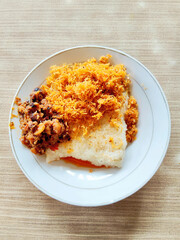 Ketan Bakar Served Alongside Spicy Oncom and Coconut Serundeng