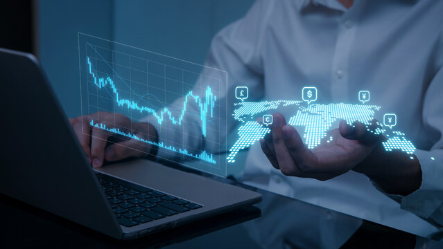 Focused businessman analyzes global business finance and international tax policy using futuristic hologram technology - Powered by Adobe