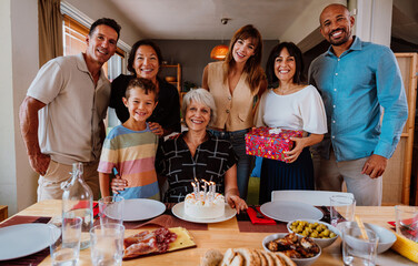 Family and friends reunion at home. Multi-generational happy family celebrating grandmother's birthday