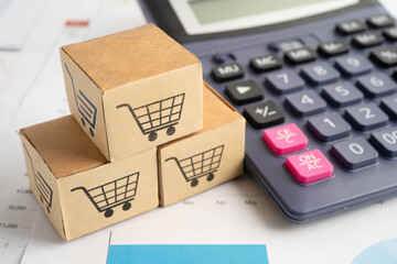 Fototapeta premium Online shopping, Shopping cart box on calculator, import export, finance commerce.