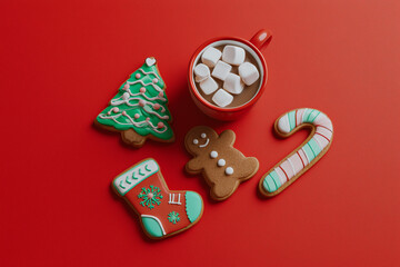 Christmas background with gingerbread cookies. Christmas baking with cocoa with marshmallows.