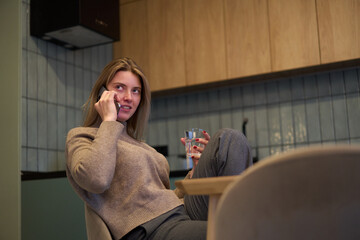 Casual Conversation Over the Phone at the Kitchen Table