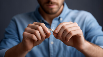 Faceless man hands breaking cigarette for good health, stop cigarette action, tobacco cessation visualization, smoking addiction recovery, nicotine-free decision, defocused hands d