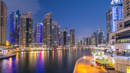 Dubai Marina towers and canal in Dubai day to night timelapse