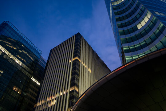 Urban architecture meets sleek skyscraper forms in La Defense, where business and finance towers rise through Paris, contributing dynamic structure and defining the skyline of the city