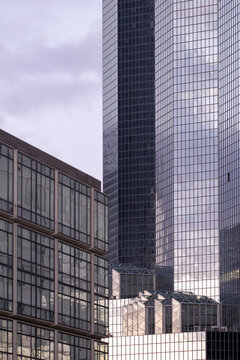 Skyscraper architecture dominates the urban environment of La Defense, blending business and finance influences through Paris tower reflections that reinforce the skyline of the city