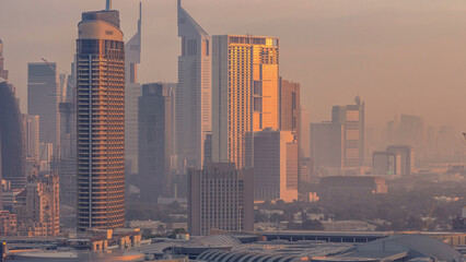 Dubai Downtown night to day timelapse. Aerial view over big futuristic city by night.
